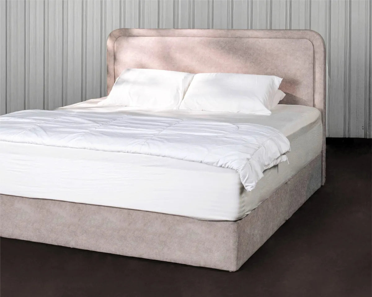 Upholstered BUILD bedframe with a soft curved headboard