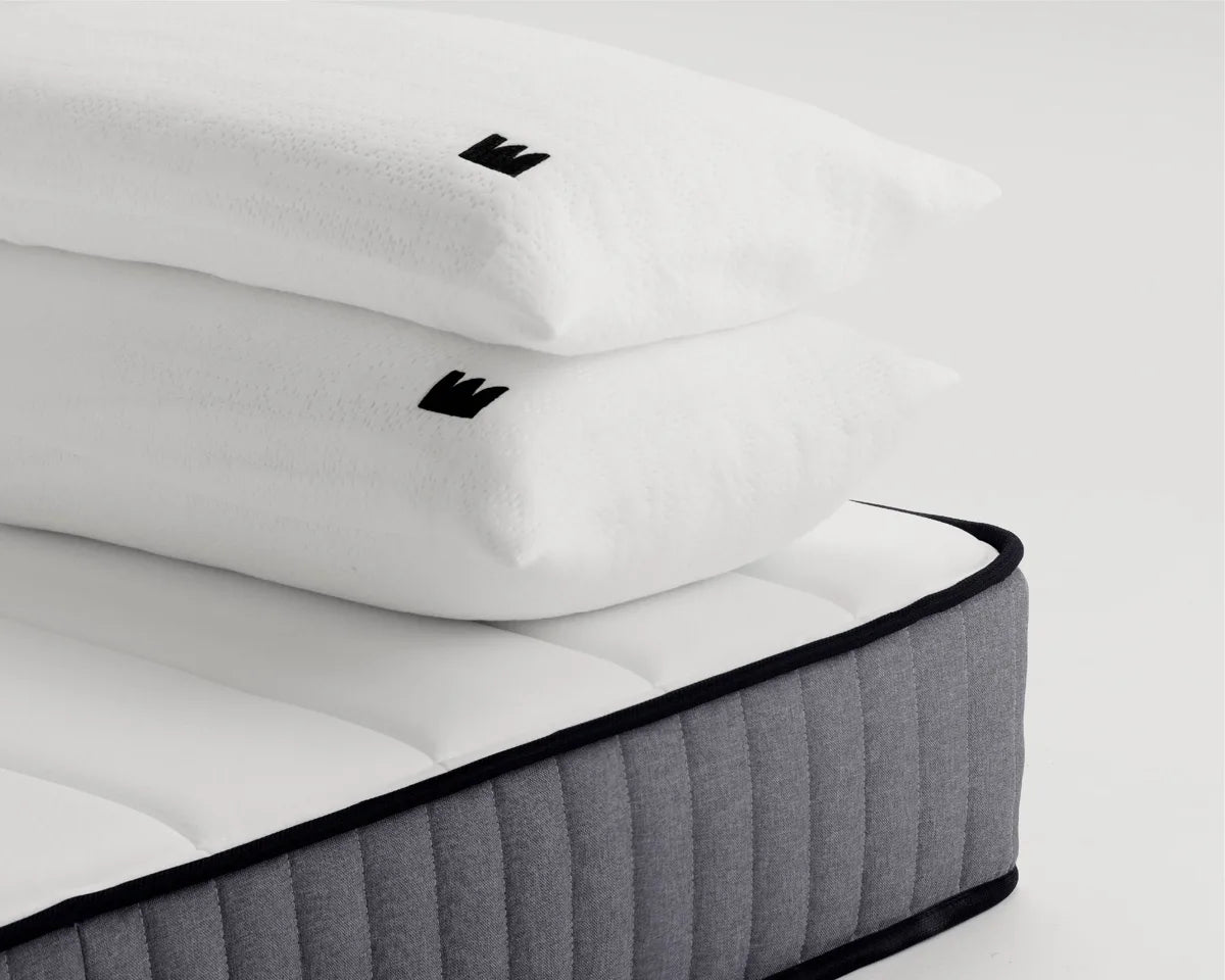 makers pillows on a mattress